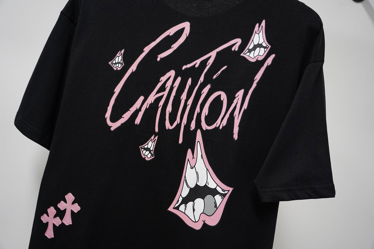 Authentic Chrome Hearts Chrome Hearts Pink Caution Cross Graphic Black Tee Shirt – front view